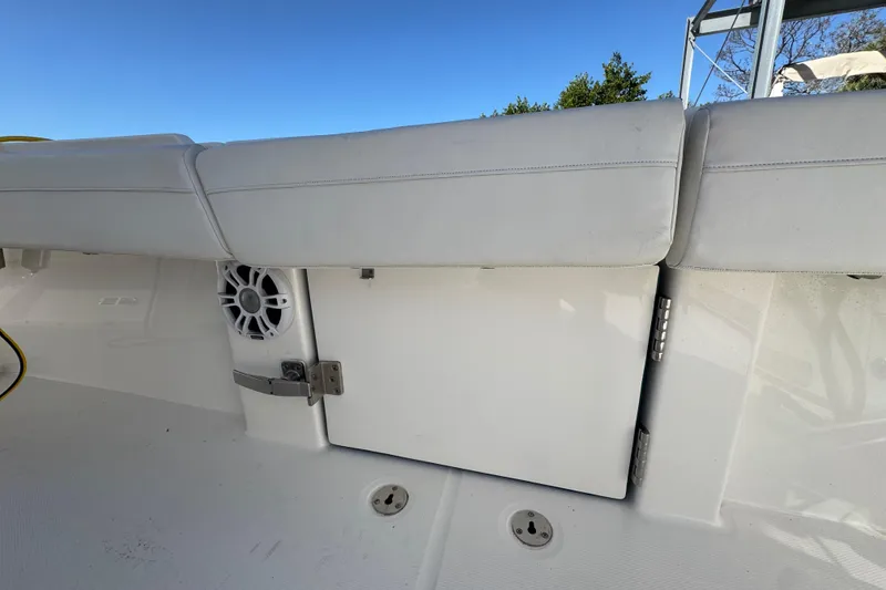 Slide: The Image of 2023 Regulator 31 boat interior with white seating and speaker detail. - 12