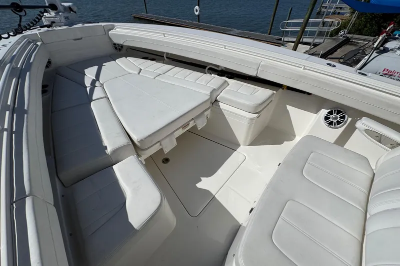 Slide: The Image of 2023 Regulator 31 boat interior with white cushioned seating and spacious layout. - 21