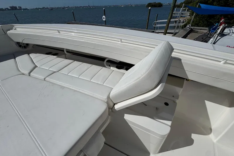Slide: The Image of 2023 Regulator 31 boat interior with white cushioned seating and ocean view. - 25