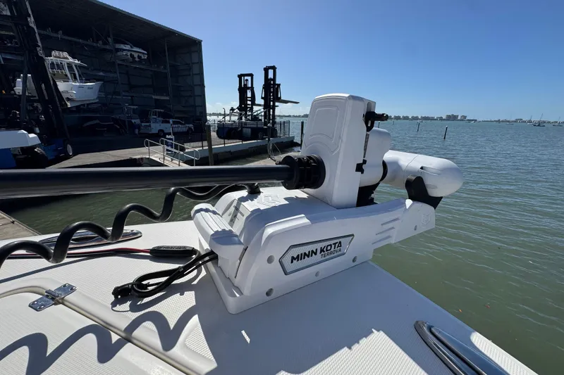Slide: The Image of Minn Kota Terrova trolling motor on 2023 Regulator 31 boat, dockside view. - 28