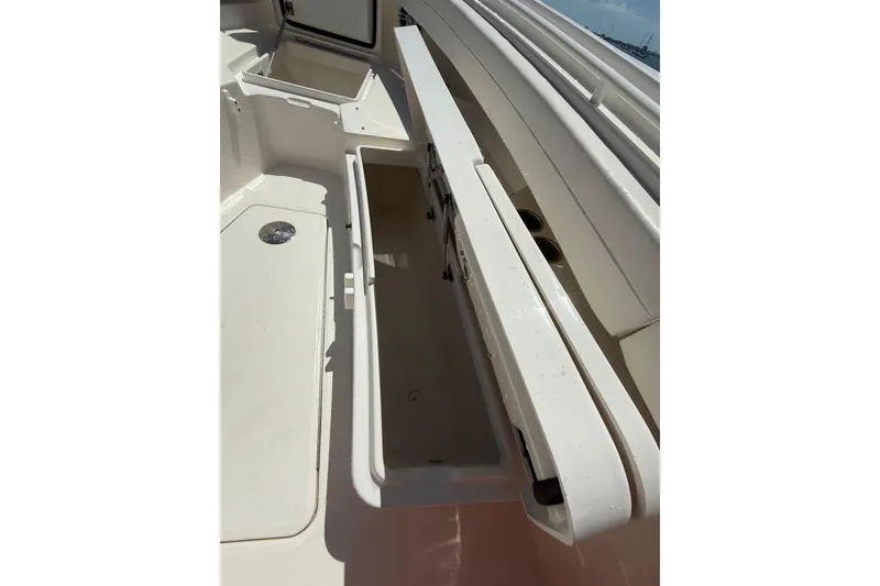 Slide: The Image of 2023 Regulator 31 boat storage compartment with open hatch, showcasing interior space. - 32
