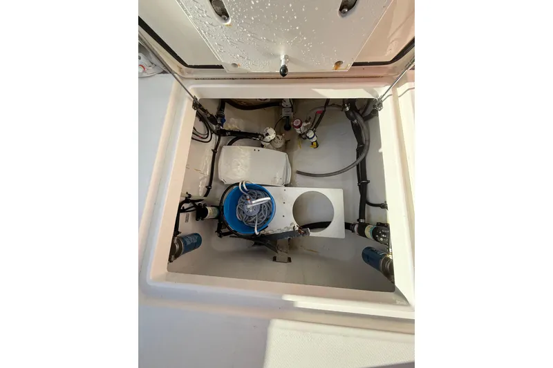 Slide: The Image of 2023 Regulator 31 boat compartment with wiring and equipment. - 35