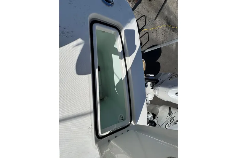 Slide: The Image of 2023 Regulator 31 boat deck with storage compartment and engine view. - 7