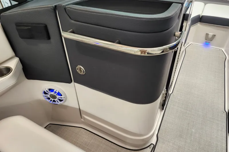 Slide: The Image of 2025 Regal LX4 boat interior with sleek design, featuring speaker and modern finishes. - 18