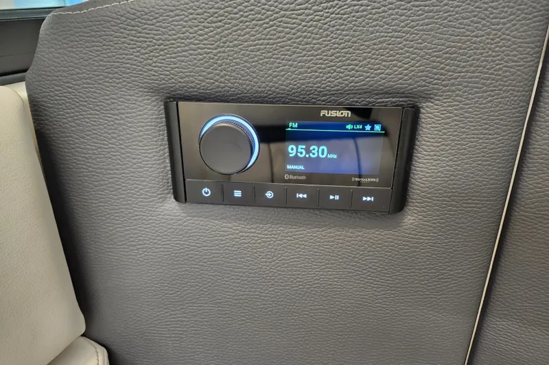 Slide: The Image of 2025 Regal LX4 audio system with Fusion radio display, featuring FM and Bluetooth options. - 21