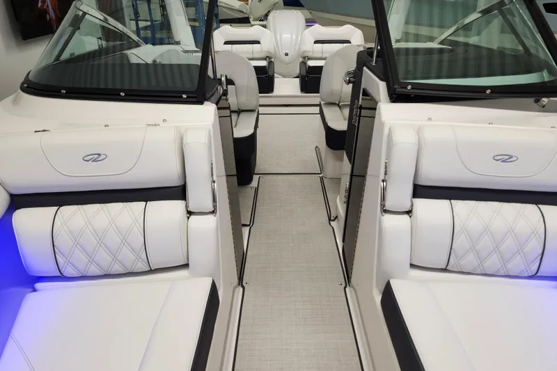 Slide: The Image of 2025 Regal LX4 boat interior with luxurious white seating and modern design. - 29