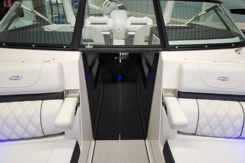Slide: The Image of 2025 Regal LX4 boat interior with white seating and modern design. - 30