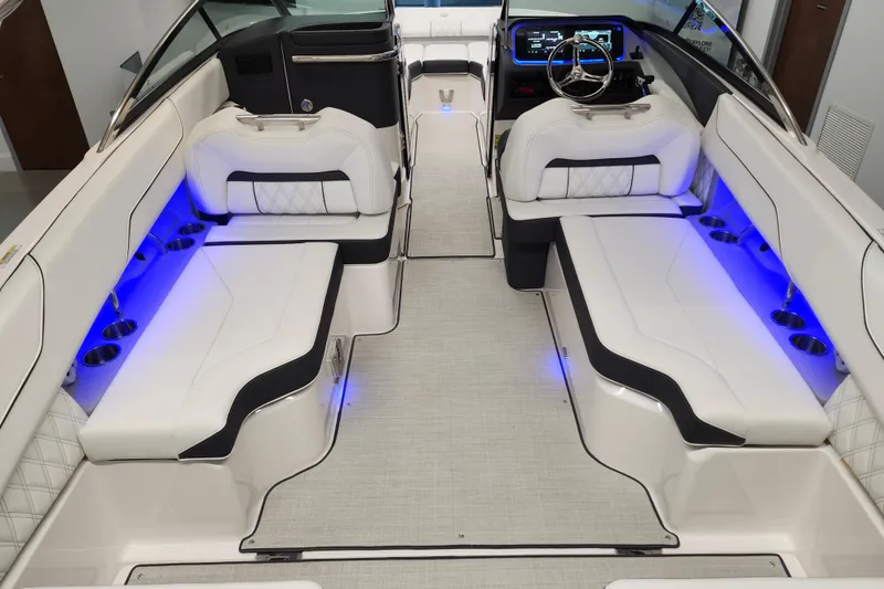 Slide: The Image of Luxurious 2025 Regal LX4 boat interior with white seating and blue LED lighting. - 8