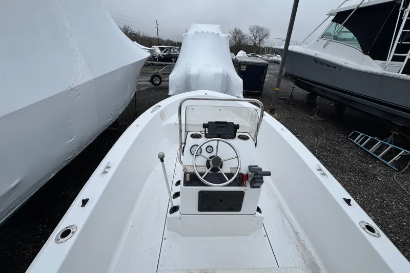 Slide: The Image of 2016 Sportsman Island Reef 17 Center Console boat in storage yard. - 9