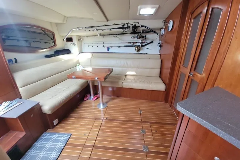 Slide: The Image of Luxurious interior of 2011 Rampage 41 Express yacht with seating and fishing gear. - 11