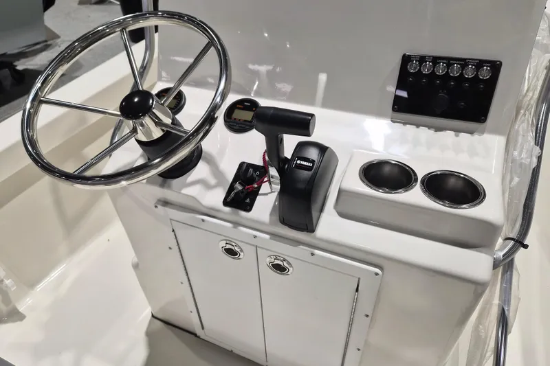 Slide: The Image of 2026 May-Craft 192 CC boat console with steering wheel and controls. - 5