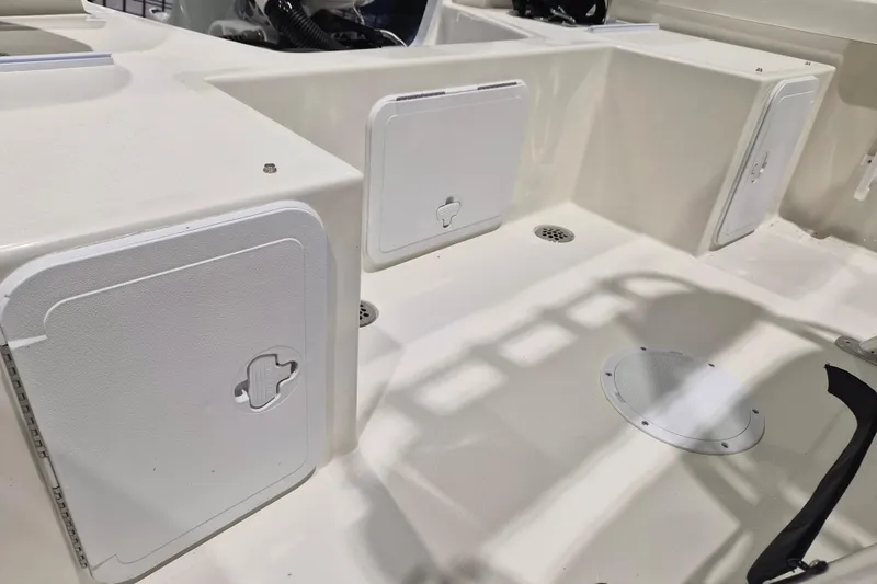 Slide: The Image of 2026 May-Craft 192 CC boat interior with storage compartments and drainage system. - 8