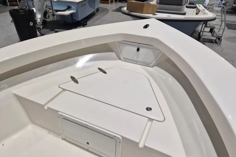 Slide: The Image of 2026 May-Craft 192 CC boat interior with storage compartments and sleek design. - 9