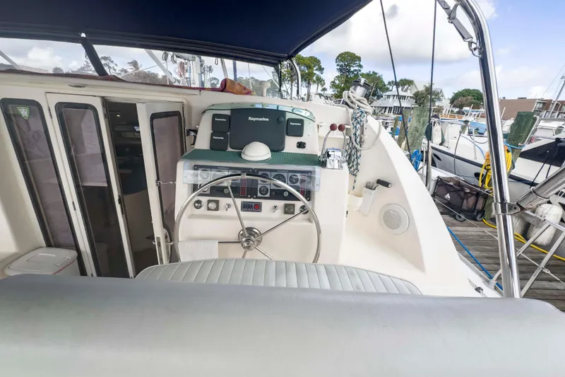 Slide: The Image of Helm of 2002 Leopard 42 catamaran with Raymarine equipment, docked at marina. - 15