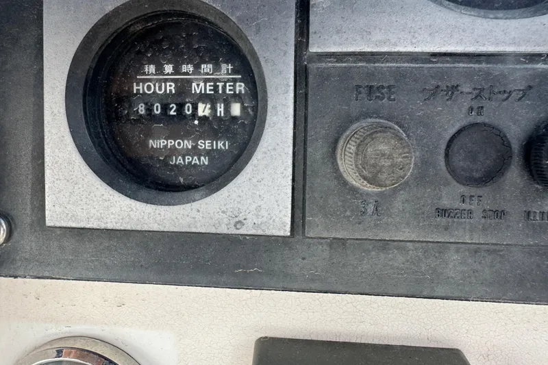 Slide: The Image of Hour meter panel on a 2002 Leopard 42, showing 8020 hours, Nippon Seiki Japan. - 18