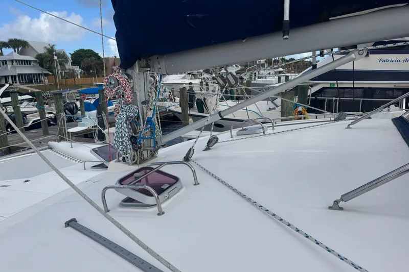 Slide: The Image of Deck view of a 2002 Leopard 42 catamaran docked at a marina. - 23
