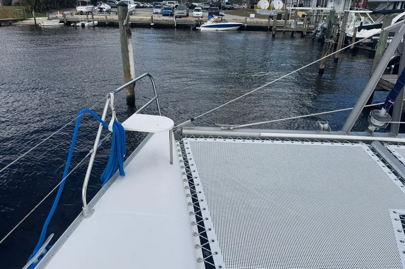 Slide: The Image of Bow of a 2002 Leopard 42 catamaran docked at a marina. - 25