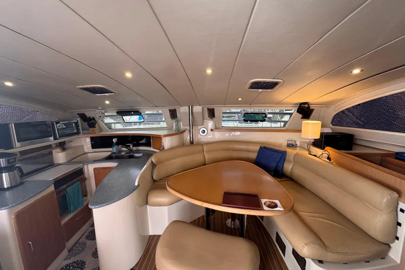 Slide: The Image of Luxurious interior of a 2002 Leopard 42 yacht with modern kitchen and cozy seating area. - 31
