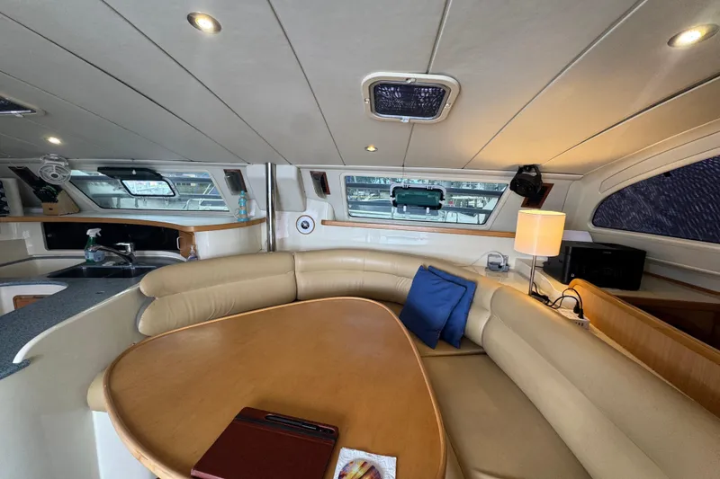 Slide: The Image of Luxurious interior of a 2002 Leopard 42 yacht with cozy seating and modern amenities. - 32