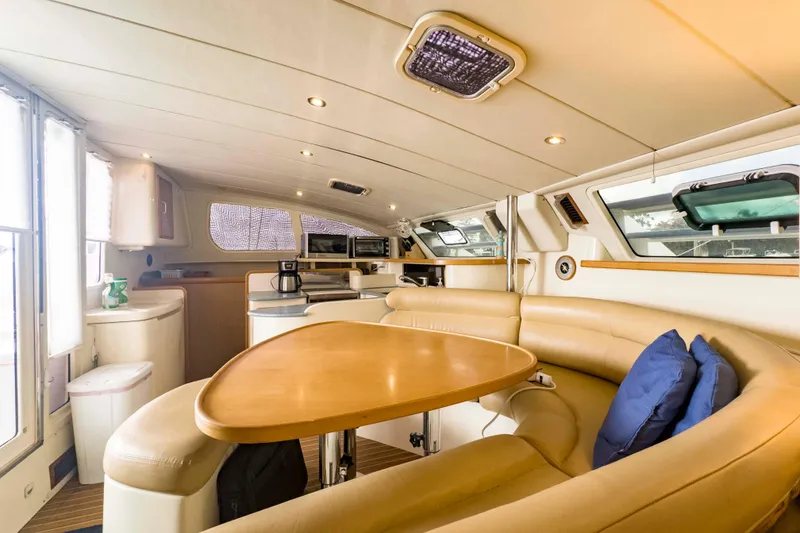 Slide: The Image of Luxurious interior of a 2002 Leopard 42 yacht with elegant seating and modern amenities. - 33