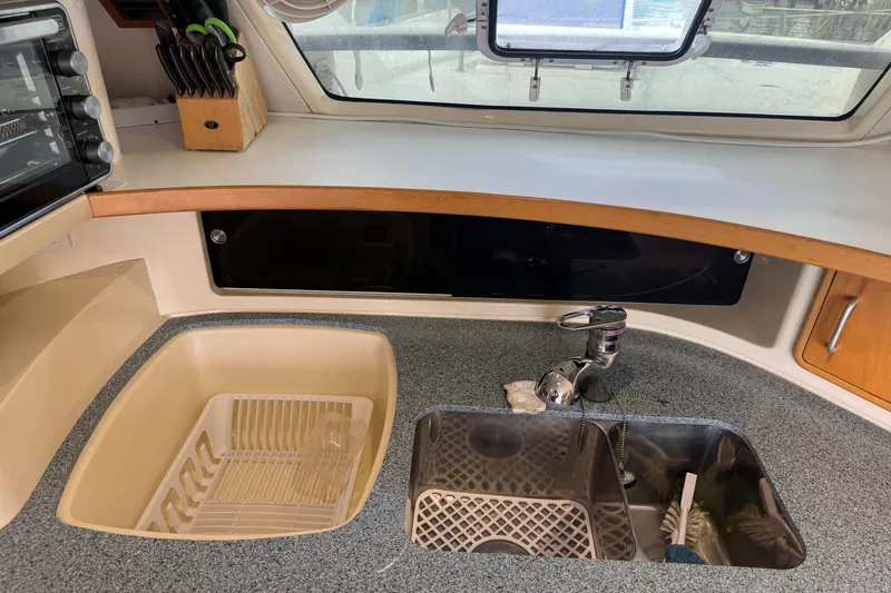 Slide: The Image of Kitchen area of a 2002 Leopard 42 yacht with sink and countertop. - 35