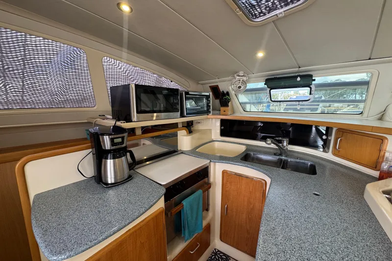 Slide: The Image of Spacious kitchen in 2002 Leopard 42 yacht with modern appliances and ample counter space. - 37