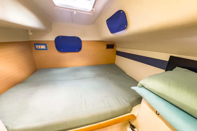 Slide: The Image of Cozy cabin interior of 2002 Leopard 42 yacht with comfortable bedding. - 41