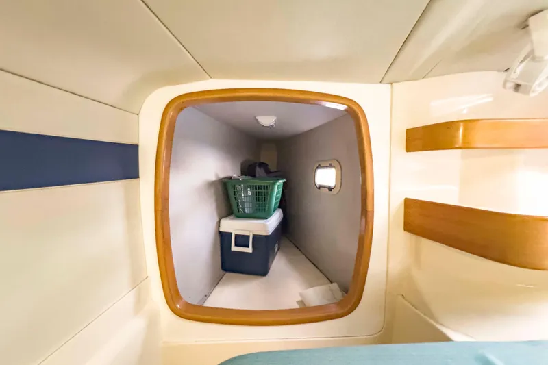 Slide: The Image of Interior storage space on a 2002 Leopard 42 yacht with cooler and basket. - 44