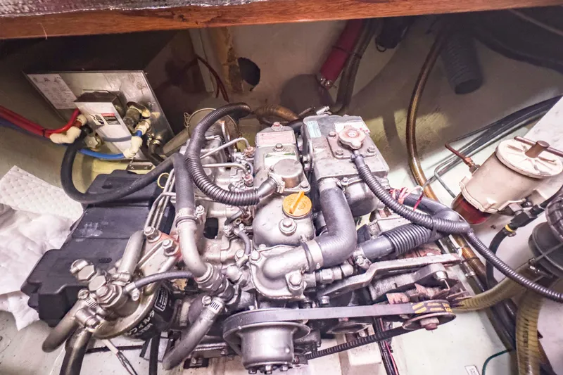 Slide: The Image of Engine compartment of a 2002 Leopard 42 boat, showcasing detailed mechanical components. - 55