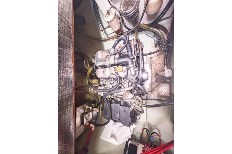 Slide: The Image of Engine compartment of a 2002 Leopard 42 yacht, showcasing intricate mechanical components. - 57