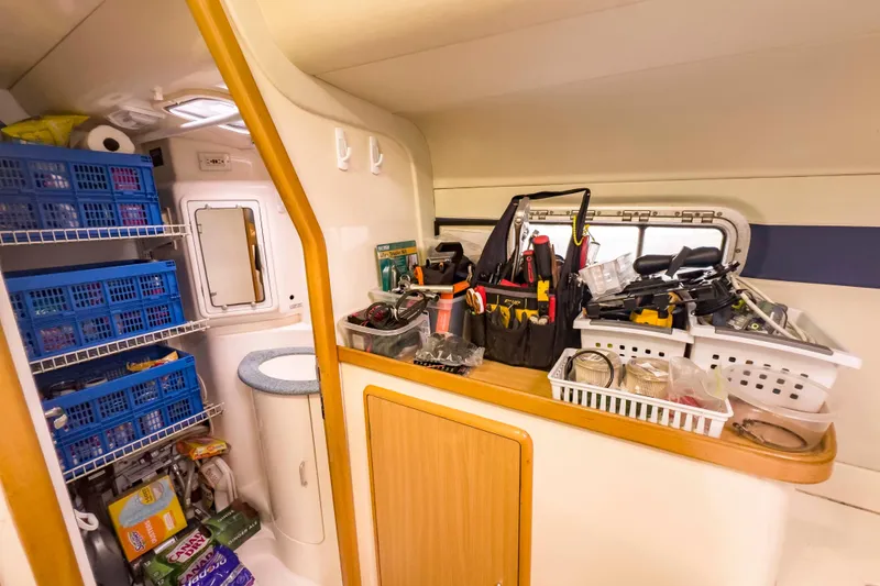 Slide: The Image of Interior of 2002 Leopard 42 yacht with organized storage and tools. - 60