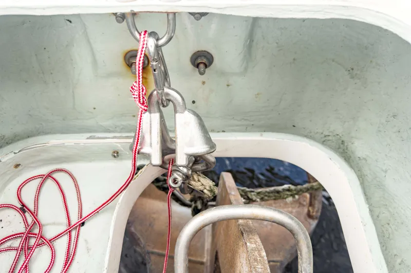 Slide: The Image of Anchor locker of 2002 Leopard 42 catamaran with ropes and metal fittings. - 64