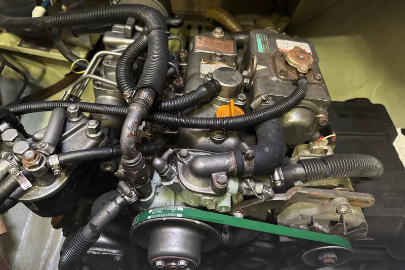 Slide: The Image of Engine of a 2002 Leopard 42 yacht, showcasing intricate mechanical components. - 70