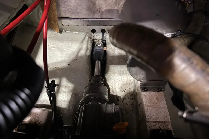 Slide: The Image of Engine compartment of a 2002 Leopard 42 boat, showing mechanical components and wiring. - 71