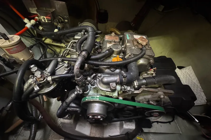 Slide: The Image of Engine compartment of a 2002 Leopard 42 yacht, showcasing detailed mechanical components. - 73