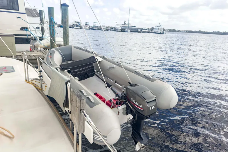 Slide: The Image of Inflatable boat with Yamaha 15 motor docked beside Leopard 42 yacht, 2002 model. - 8