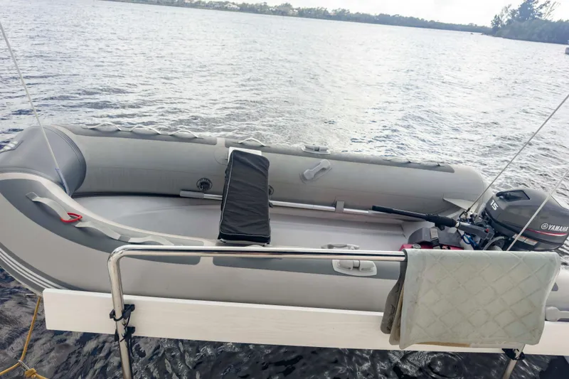 Slide: The Image of Inflatable boat with Yamaha motor on water, near Leopard 42 catamaran, 2002 model. - 9