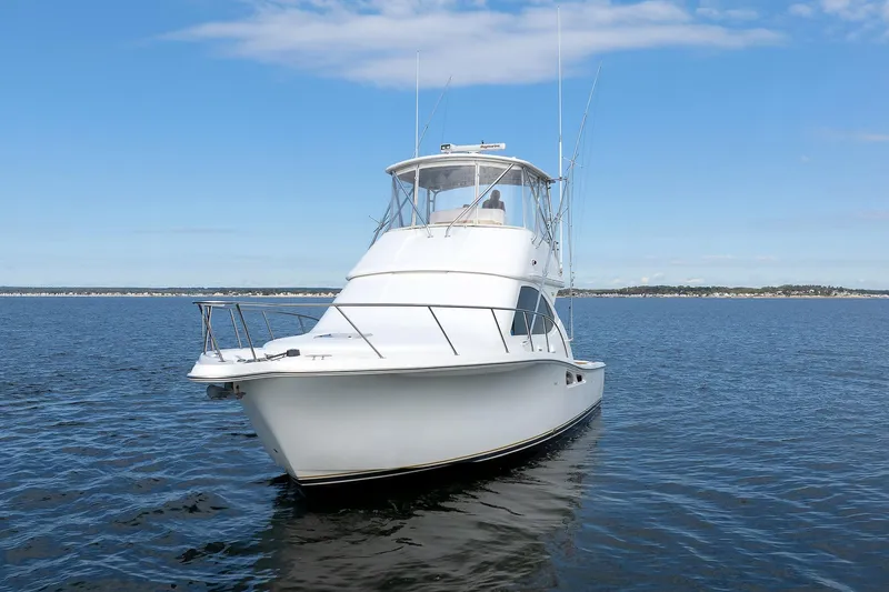 Slide: The Image of 2007 Tiara Yachts 3900 Convertible on open water under blue sky. - 13
