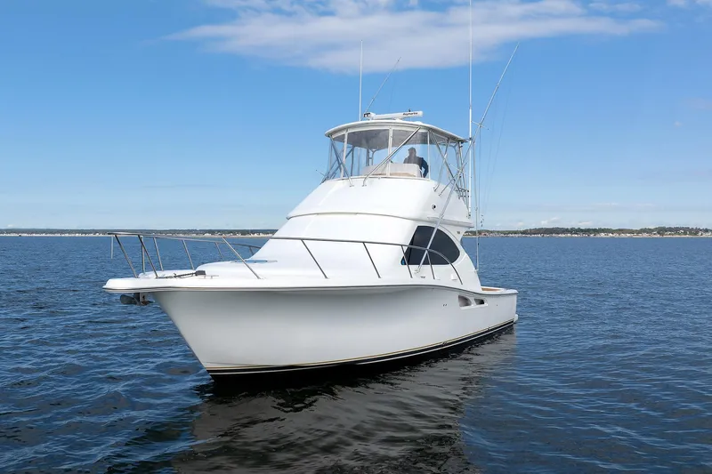 Slide: The Image of 2007 Tiara Yachts 3900 Convertible on open water under clear sky. - 14