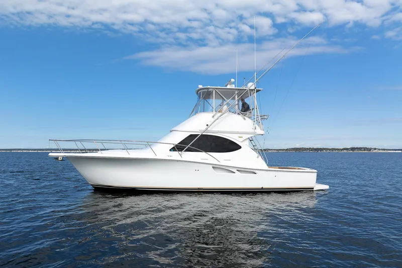 Slide: The Image of 2007 Tiara Yachts 3900 Convertible on open water under blue sky. - 17