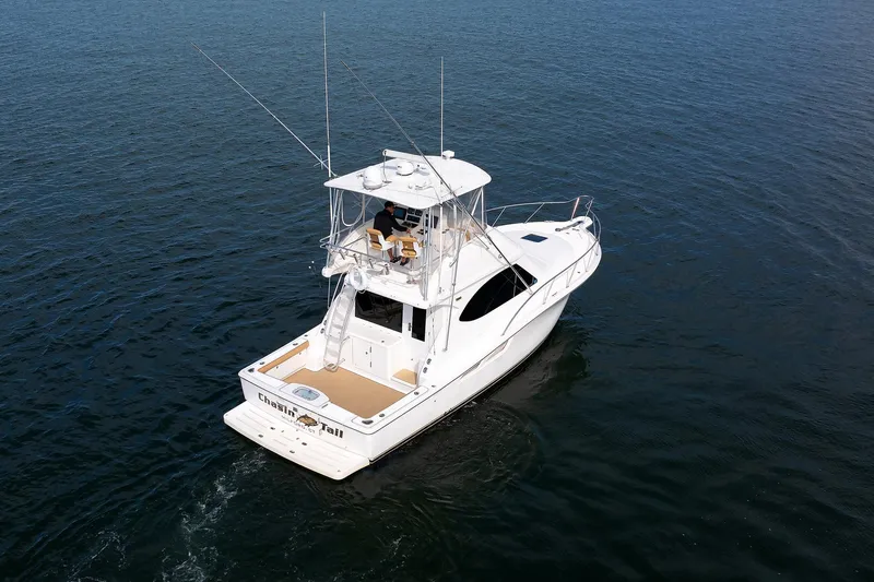 Slide: The Image of 2007 Tiara Yachts 3900 Convertible cruising on open water. - 21