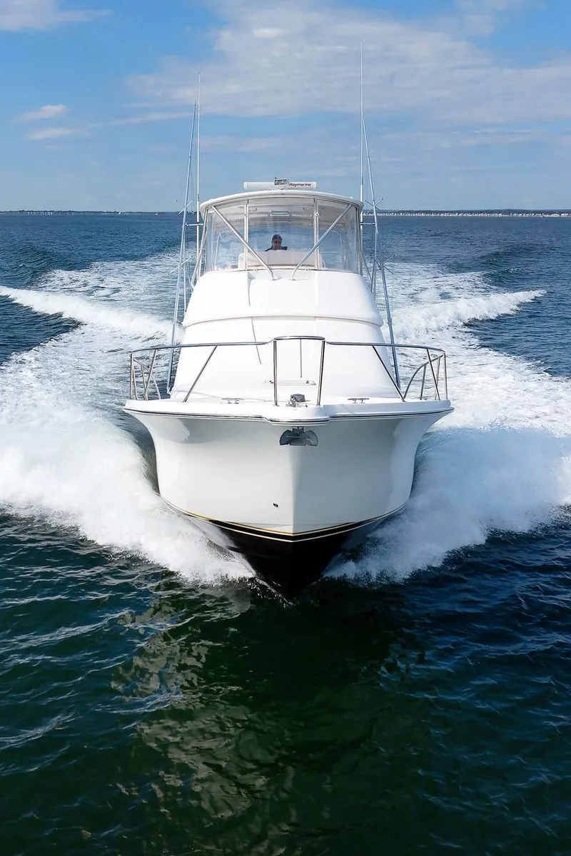Slide: The Image of 2007 Tiara Yachts 3900 Convertible cruising on open water. - 31
