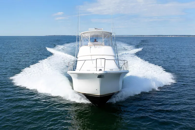 Slide: The Image of 2007 Tiara Yachts 3900 Convertible cruising on open water. - 32