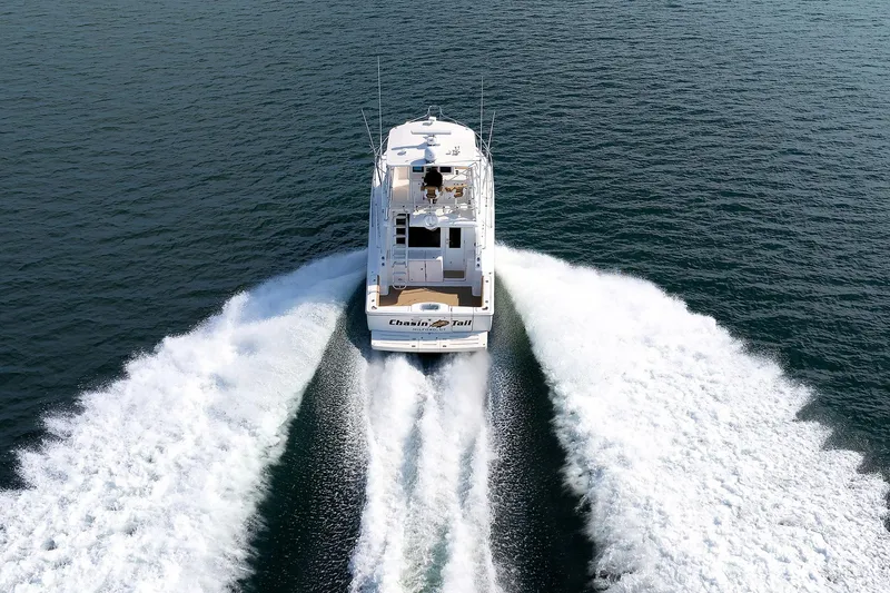 Slide: The Image of 2007 Tiara Yachts 3900 Convertible cruising on open water, rear view. - 40