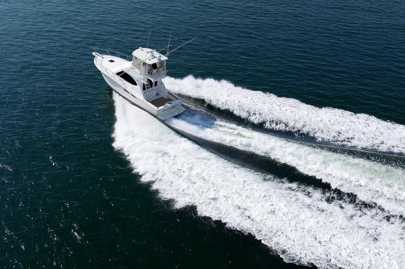 Slide: The Image of 2007 Tiara Yachts 3900 Convertible cruising on open water. - 46