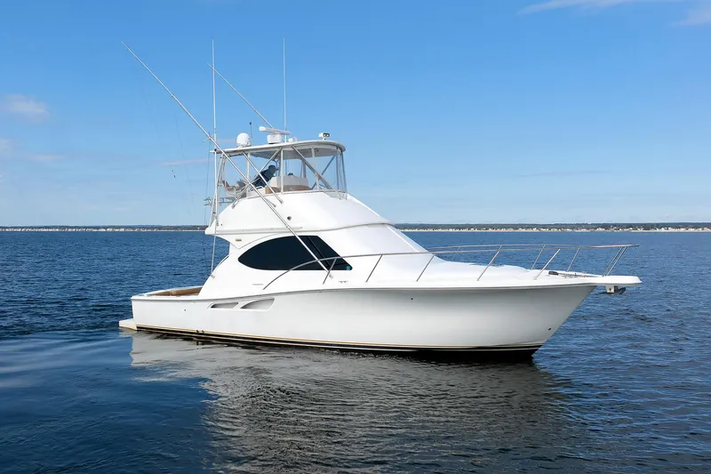 Slide: The Image of 2007 Tiara Yachts 3900 Convertible on calm water, clear sky background. - 7