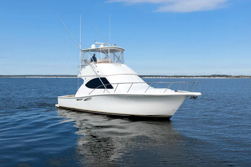 Slide: The Image of 2007 Tiara Yachts 3900 Convertible on open water, clear sky background. - 9