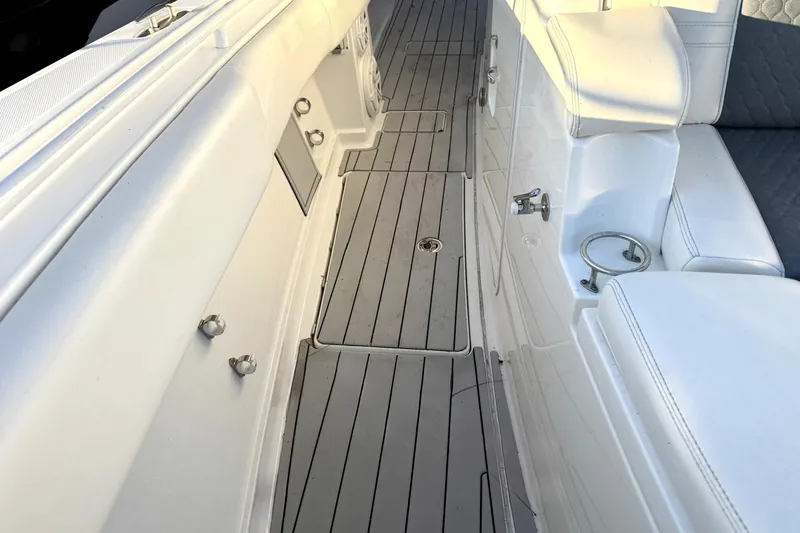 Slide: The Image of 2019 HCB 39 Speciale boat interior with sleek white seating and deck. - 15
