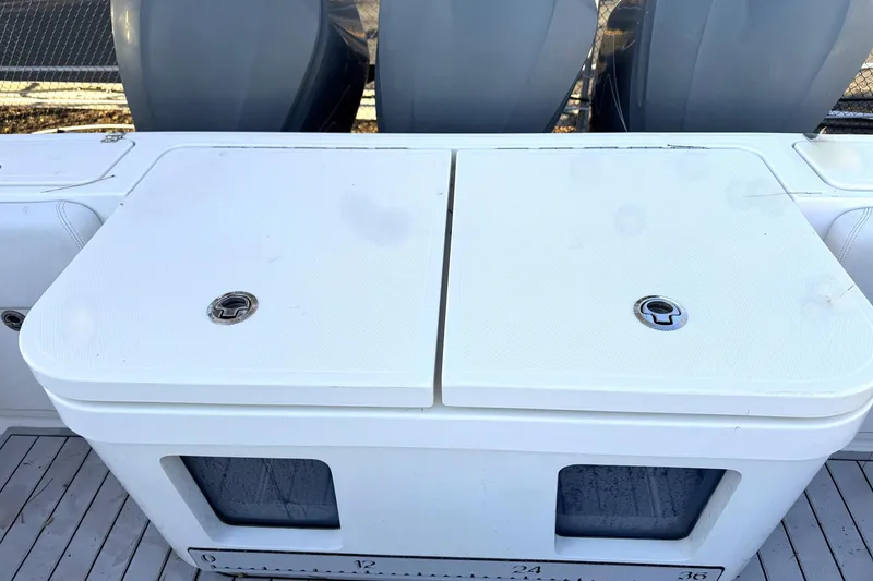 Slide: The Image of 2019 HCB 39 Speciale boat deck with storage compartments and outboard engines. - 27