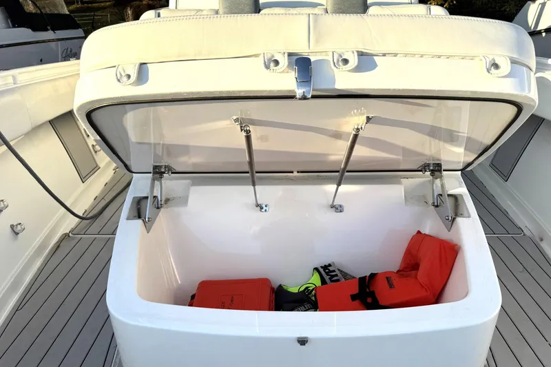 Slide: The Image of Open storage compartment on 2019 HCB 39 Speciale boat with life jackets inside. - 29